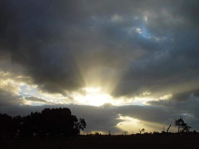 Sun Shining Through Dark Clouds