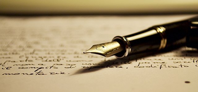 writing pen on paper
